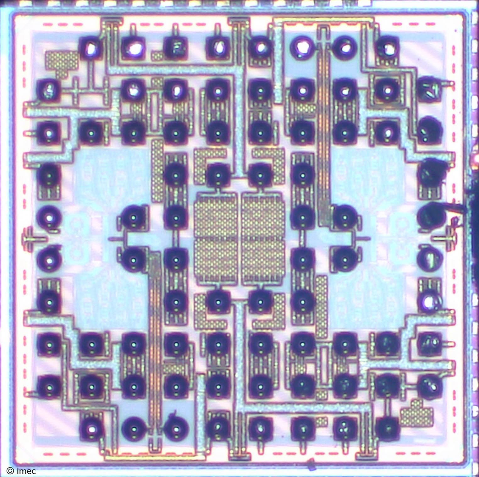 Micrograph of semiconductor die with DAC channels Micrograph of a semiconductor die with two DAC channels and bond pads.