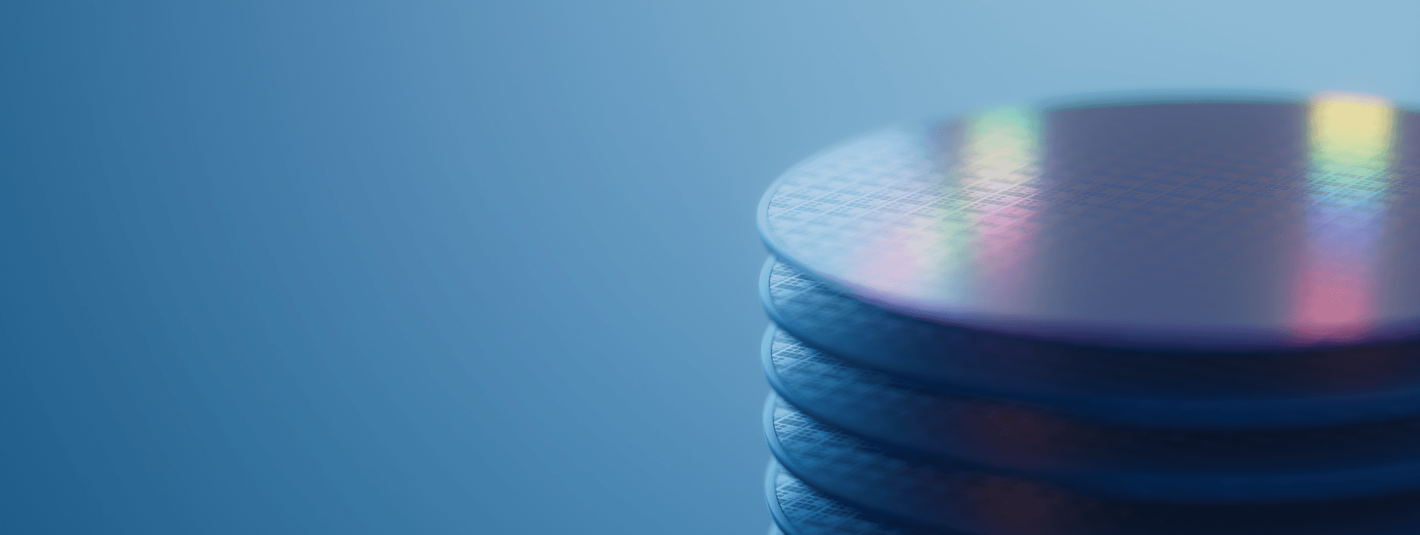 iSiPP200%20webinar Stack of silicon wafers with iridescent reflections on a blue background