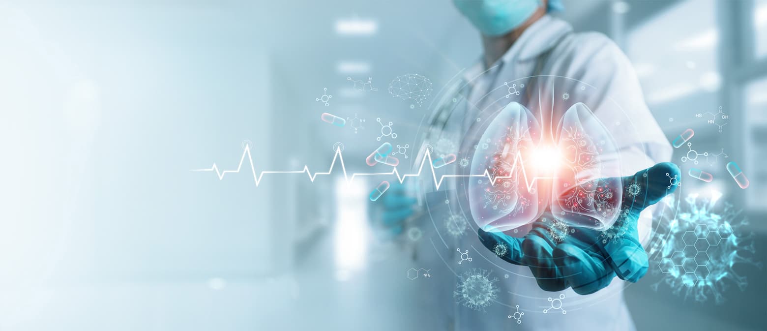iStock-1220059276 Masked researcher in a lab holding a glowing digital lung scan with medical data overlays