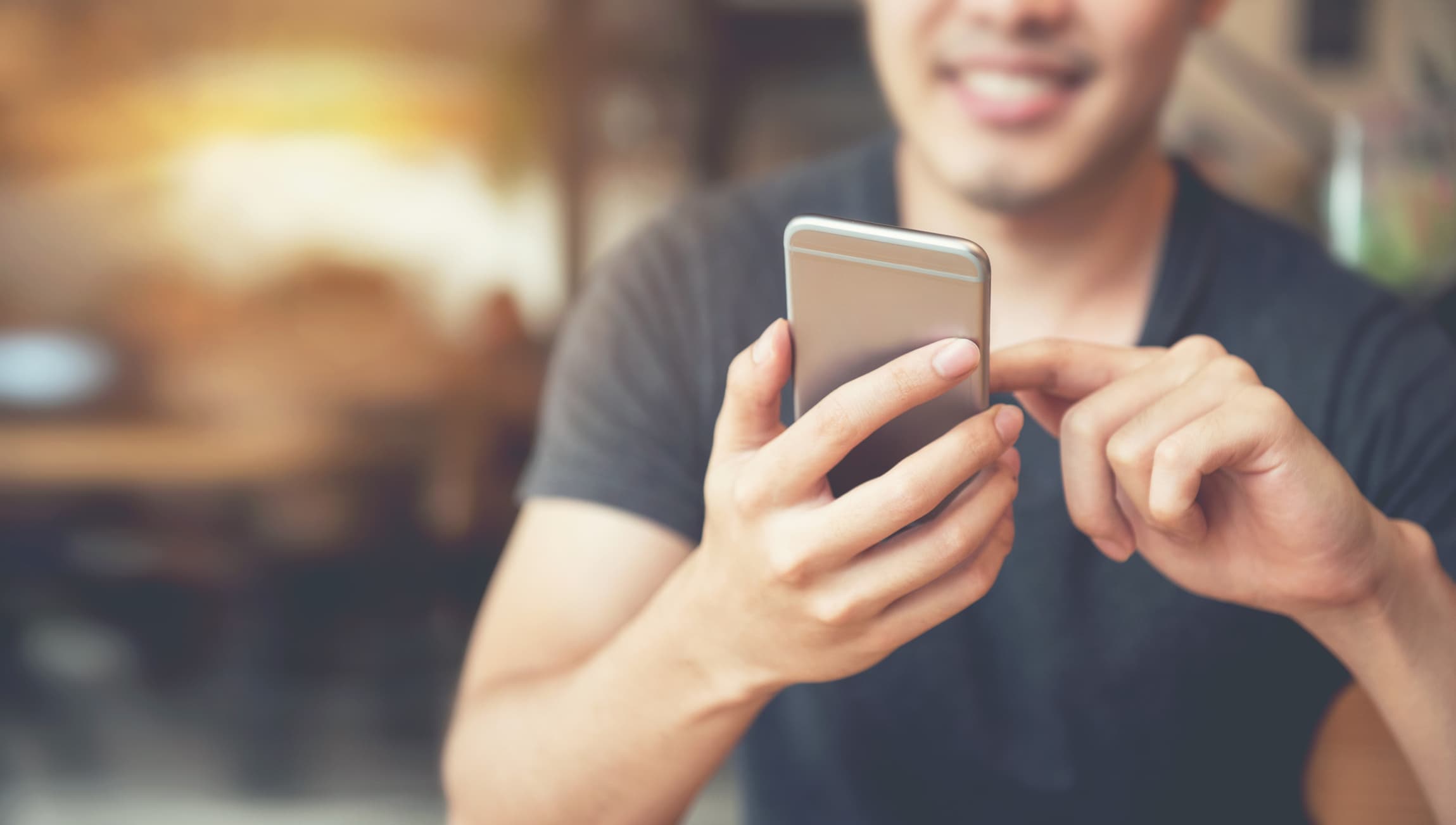 Person using a smartphone tapping the screen Person using a smartphone with one finger tapping the screen
