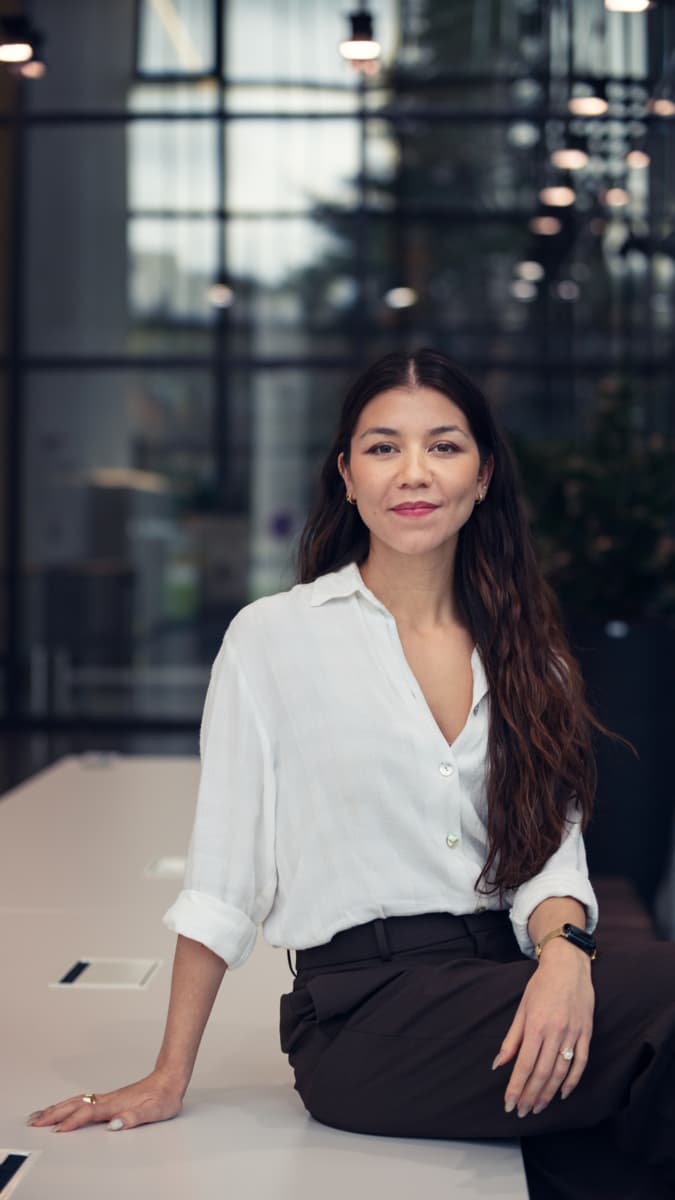 Jade-Liu-2024-update Portrait of Jade Liu, International press officer, seated in a modern office setting