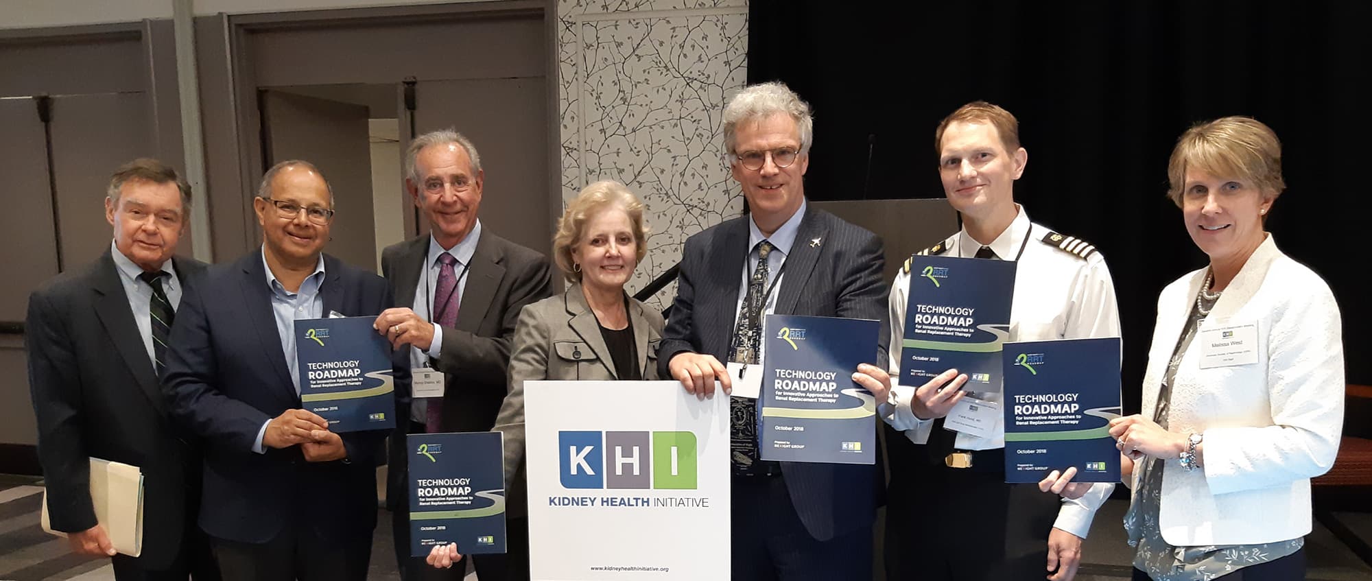 KHI Group of KHI roadmap members posing with Kidney Health Initiative technology roadmap booklets