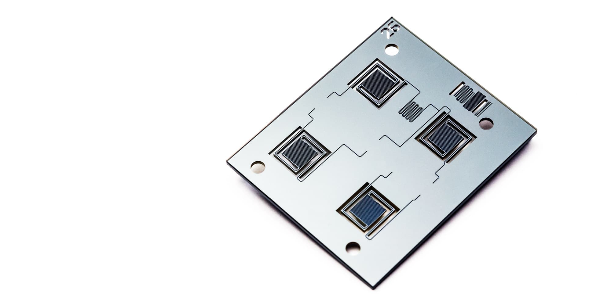 life-sciences-technology-platform-pcronchip_1 Silicon neural probe chip with four square electrode arrays on a metallic plate