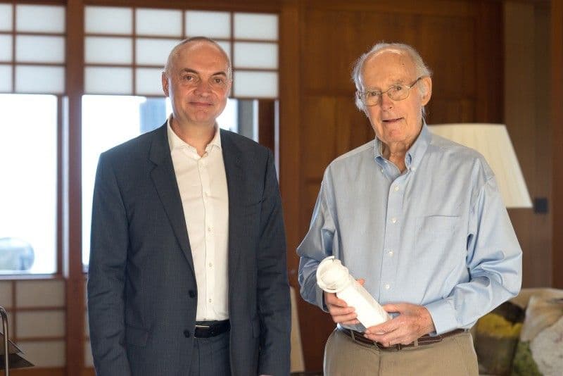 Luc%20Van%20den%20hove%20Gordon%20Moore Luc Van den hove standing beside Gordon Moore, who is holding a rolled document
