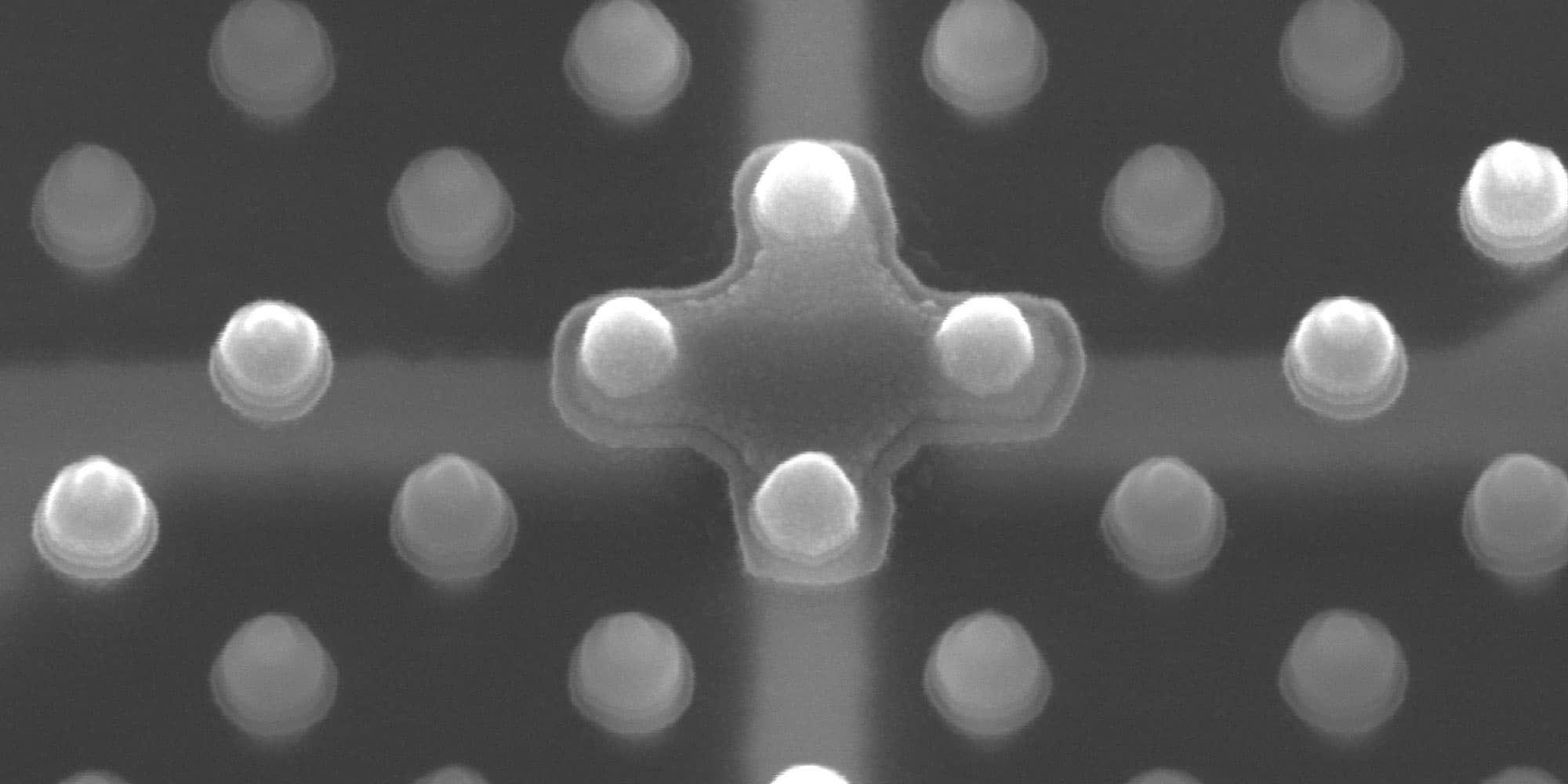 magnetic-domain-wall-services Scanning electron micrograph of a magnetic domain wall device pattern with clustered nanoscale posts
