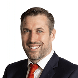 MicrosoftTeams-image%20%286%29 Portrait of Fergal Ward, founder and CEO of Capri-Medical, smiling in a suit and red tie