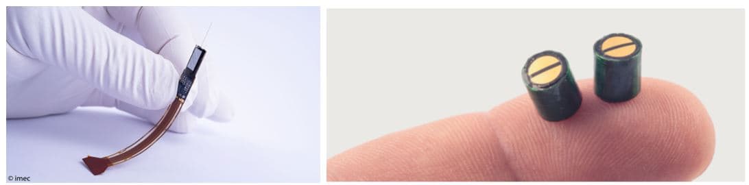 needle%20and%20cuff%20probes Gloved hand holding a microneedle neuroprobe beside two tiny implantable sensor nodes on a fingertip