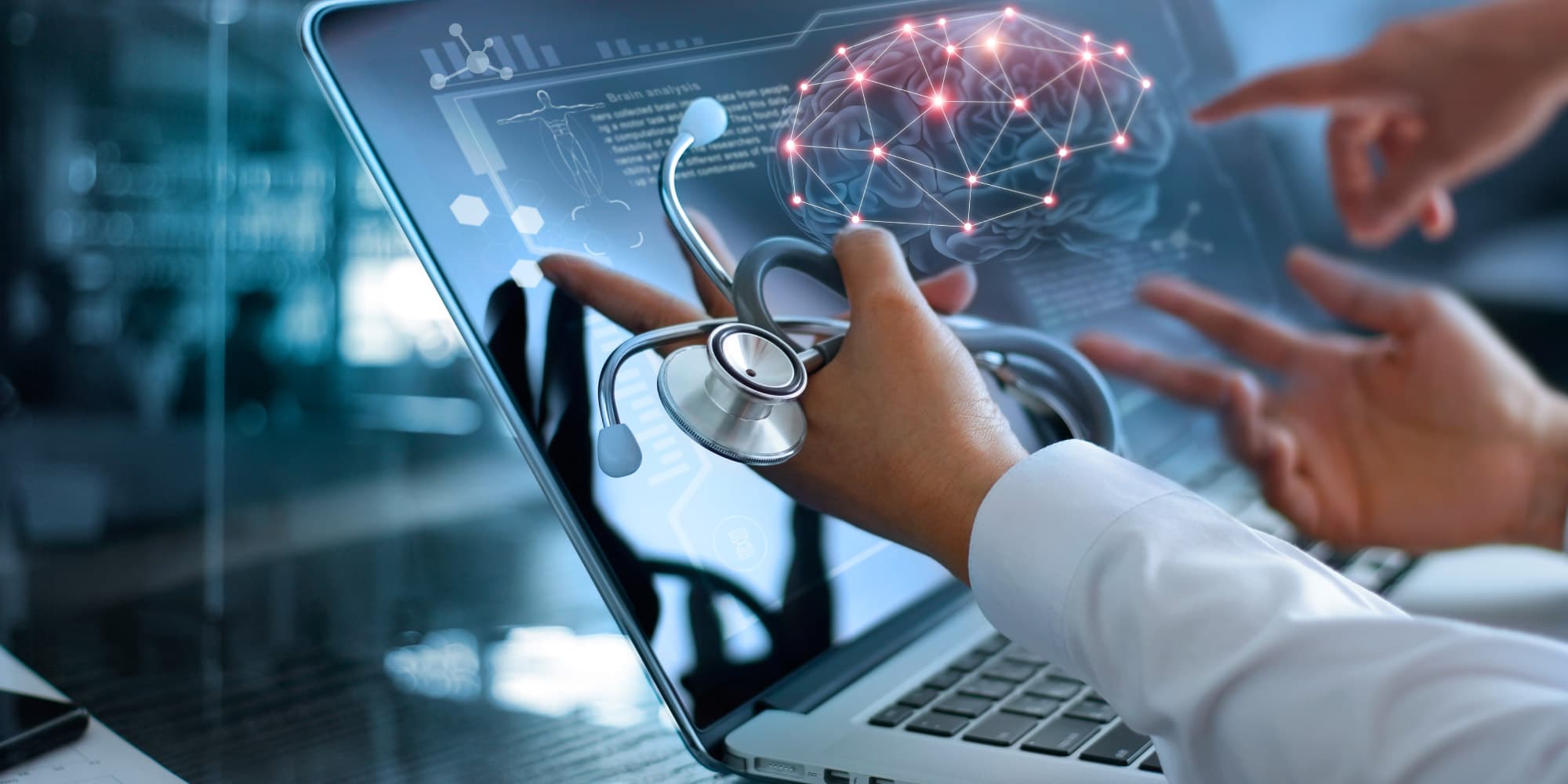 neural_banner_1 Doctor holding a stethoscope toward a laptop screen showing a brain scan and digital network overlay