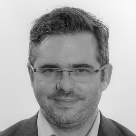philippe-bw%20copy Portrait of Philippe Soussan wearing glasses and a dark jacket
