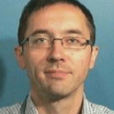 philippe_leray_1 Headshot of Philippe Leray wearing glasses against a blue background