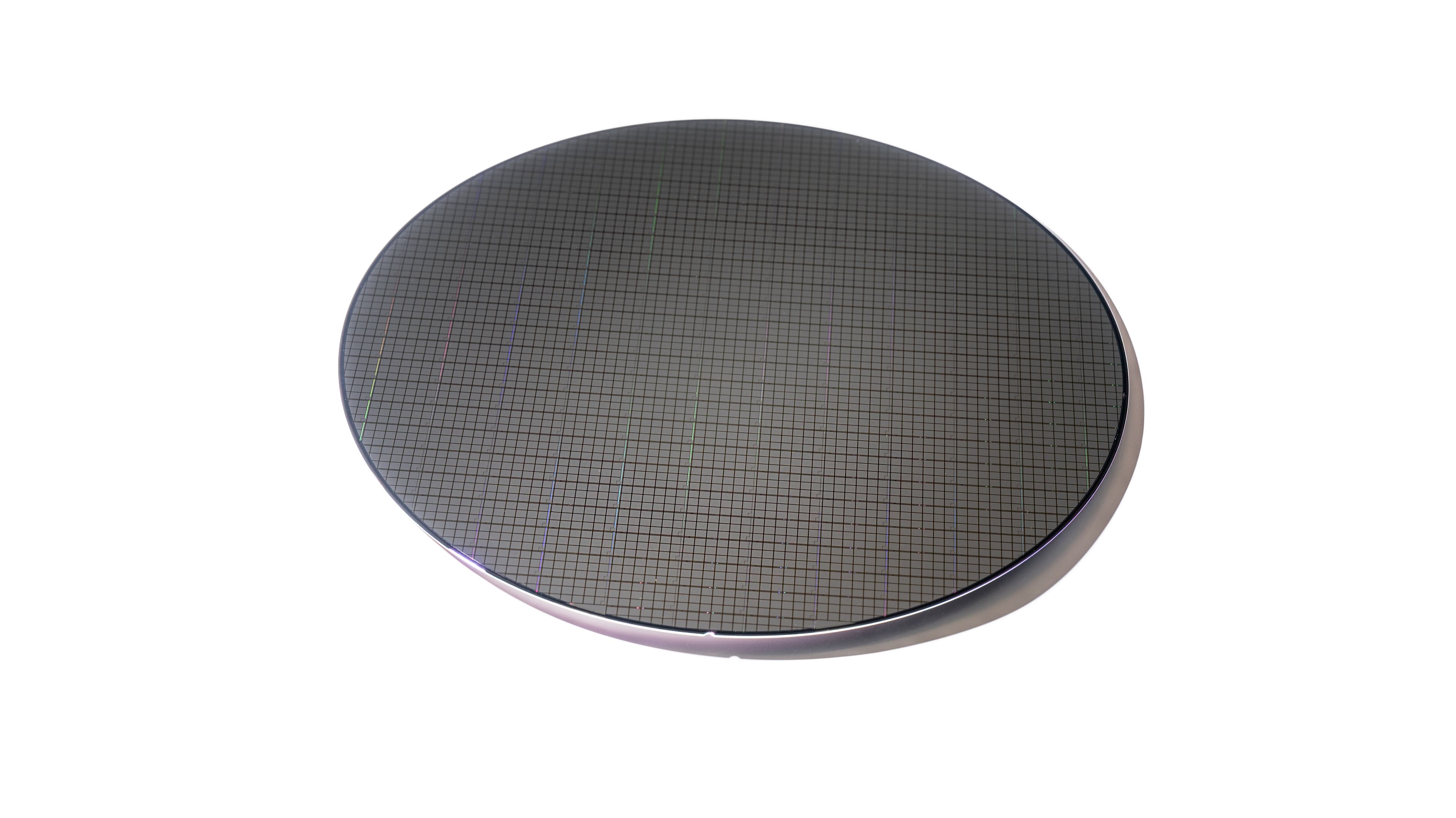 Silicon wafer with fine grid pattern Silicon wafer with a fine grid pattern on a white background