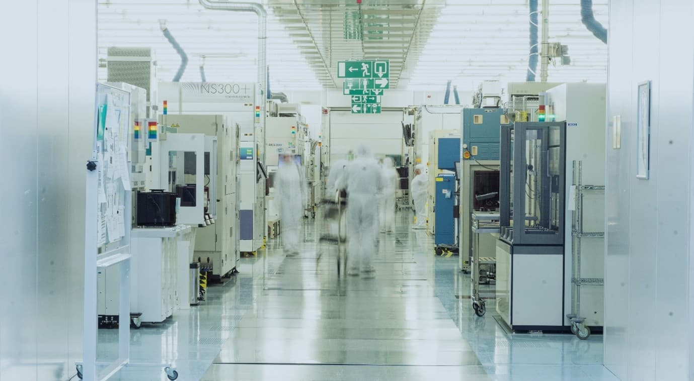 Protein%20engineering%20tools Cleanroom corridor with researchers in white suits between semiconductor tools and equipment
