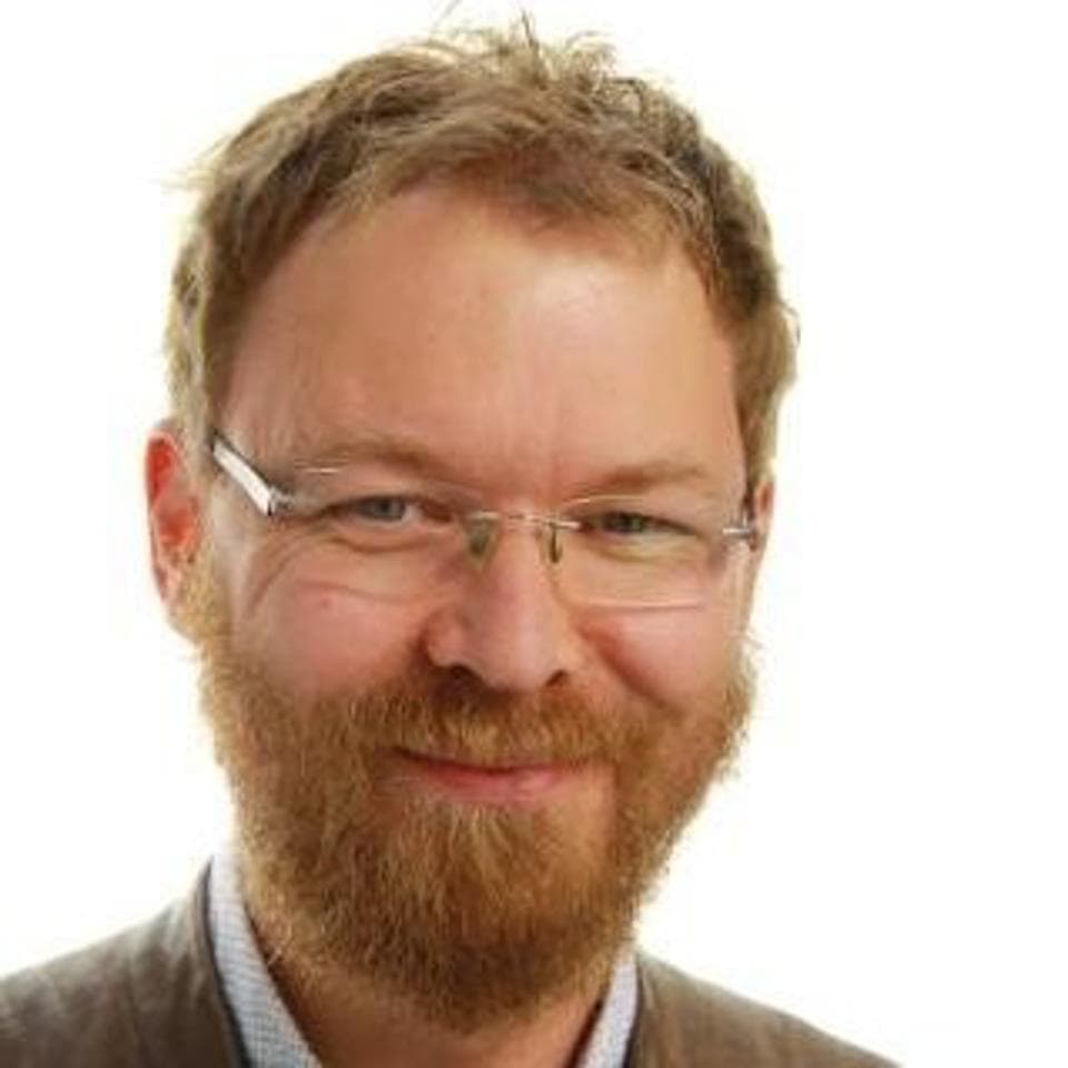 roelwuyts Portrait of Roel Wuyts with glasses and a beard on a white background