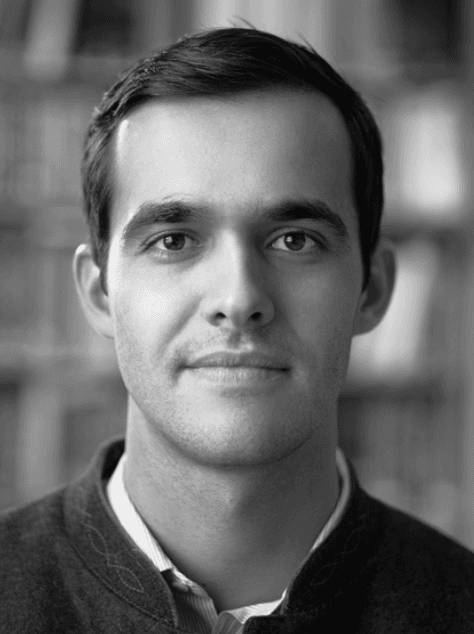 Portrait of man with bookshelf background Portrait of Karel Van Keer, consultant ophthalmologist at UZ Leuven