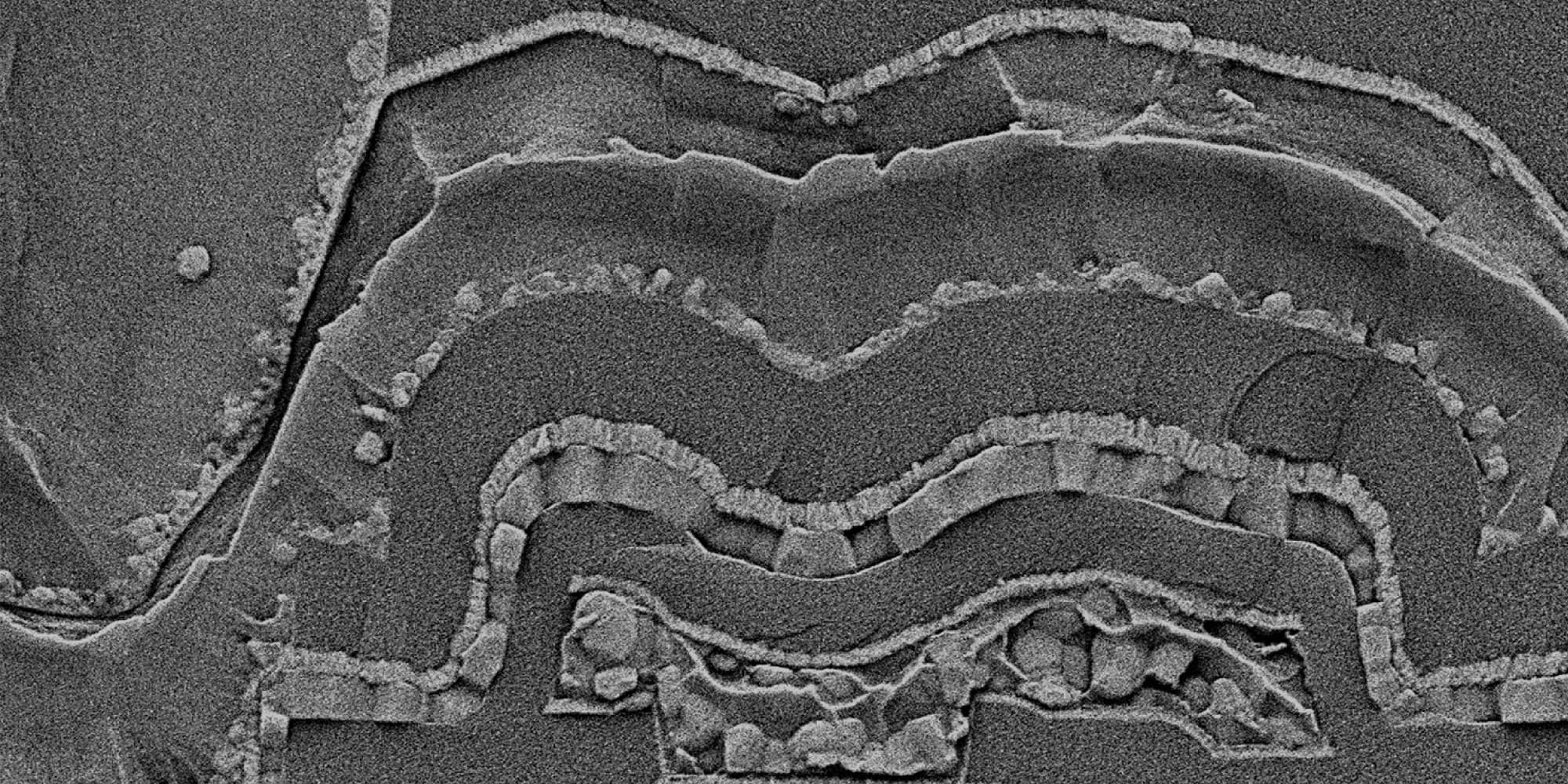 SEM-header-2 Scanning electron micrograph of layered GaN device structures on a chip