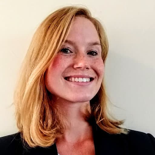 Siri%20Luthman Portrait of Siri Luthman smiling against a plain background