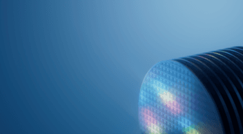 SLAS2026 Close-up of a glowing semiconductor wafer against a blue background