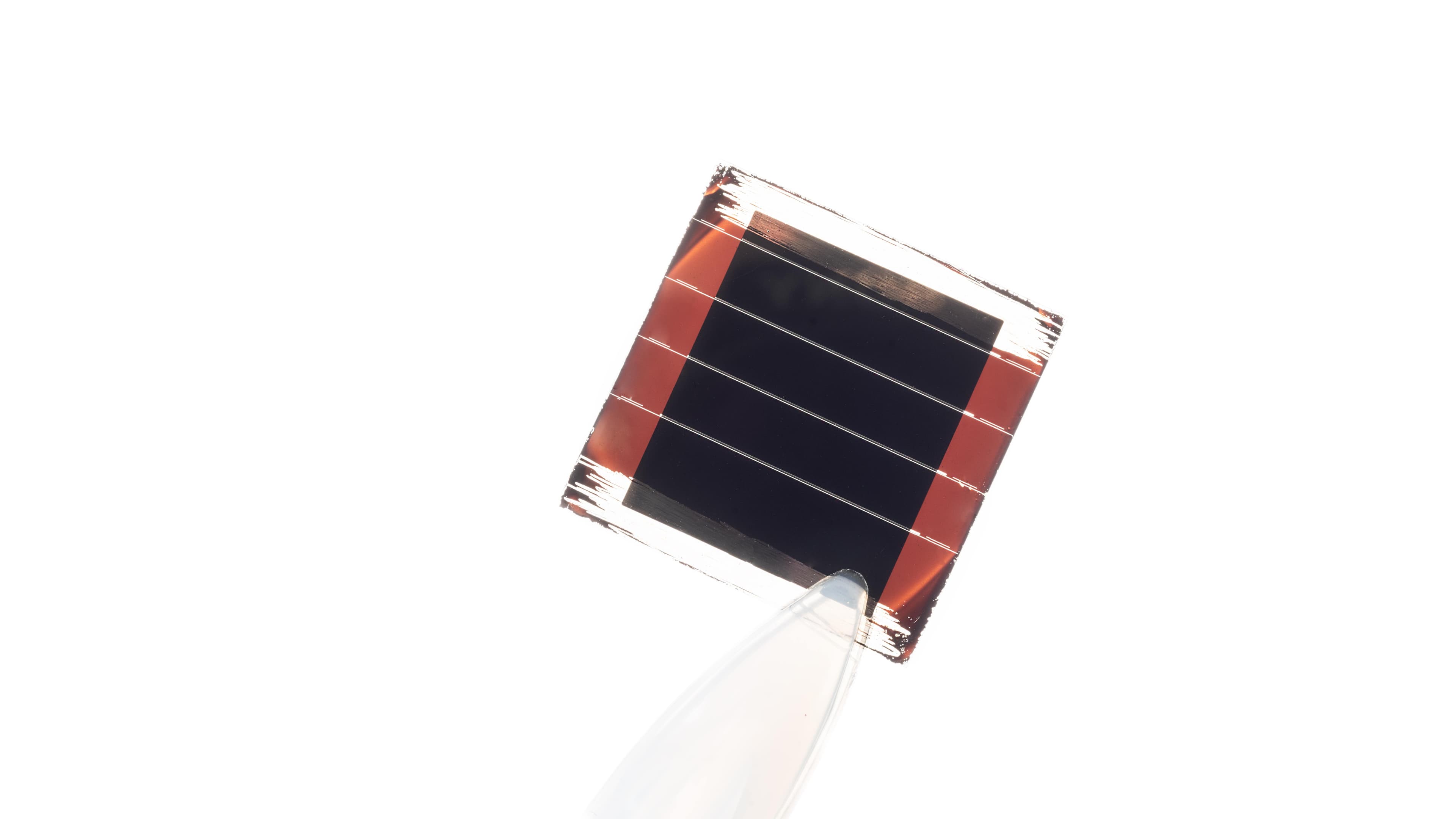 solar-cell-mini-module001_1mb Mini solar cell module held by a gloved hand on a white background