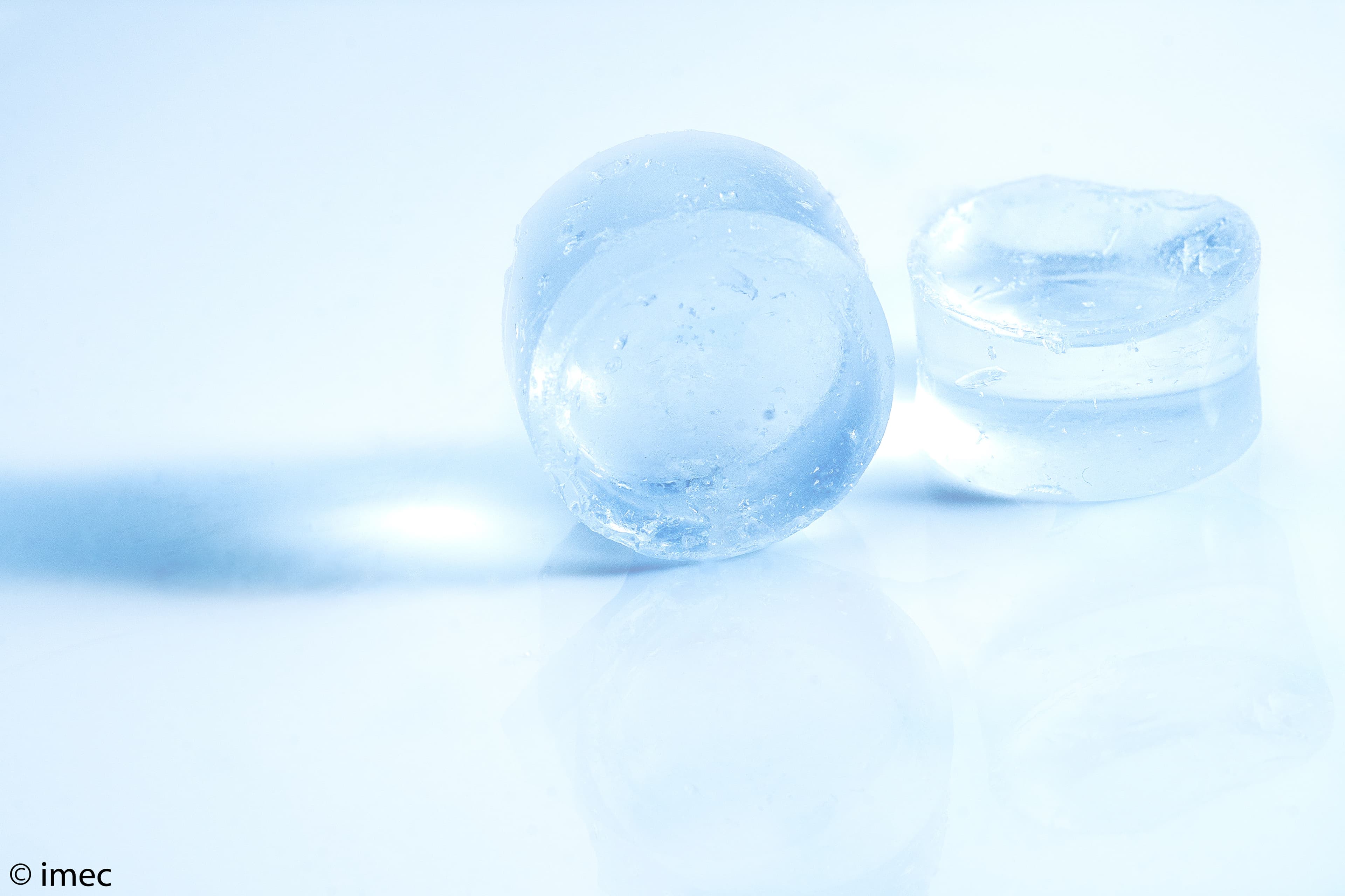 SolidStateBatteries_3 Translucent blue solid electrolyte pellets on a white surface