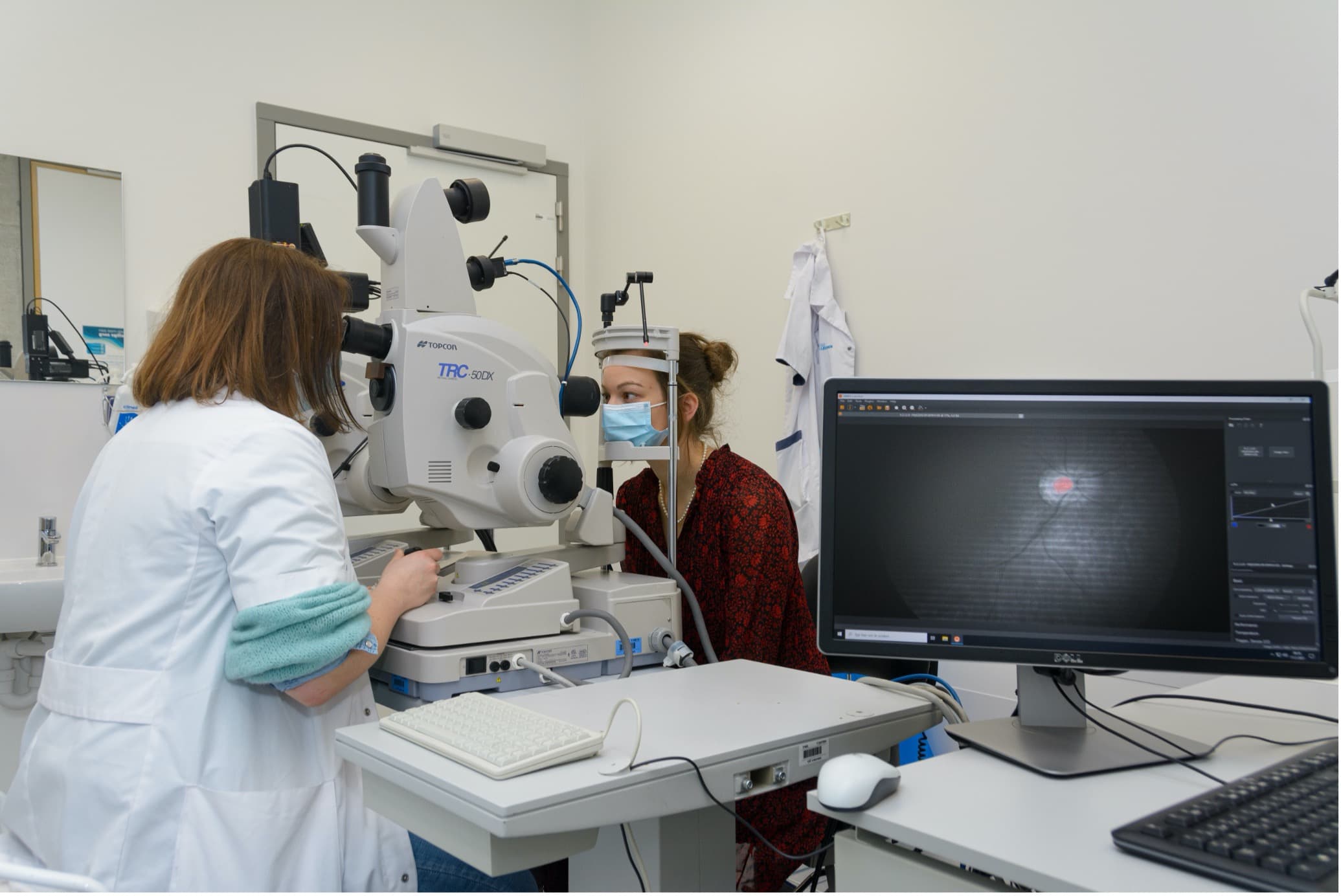 stalmans-lab Researcher uses a hyperspectral eye camera to examine a patient's retina in a lab