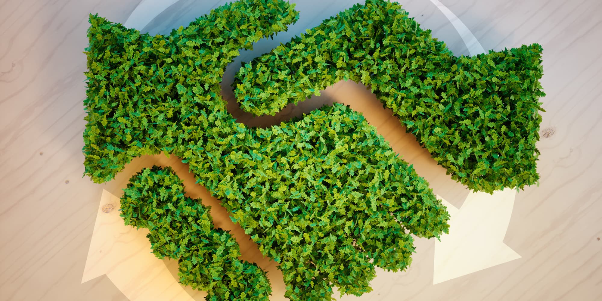 sustainability-questionnaire Aerial view of a green leaf-covered recycling symbol on a light wooden background