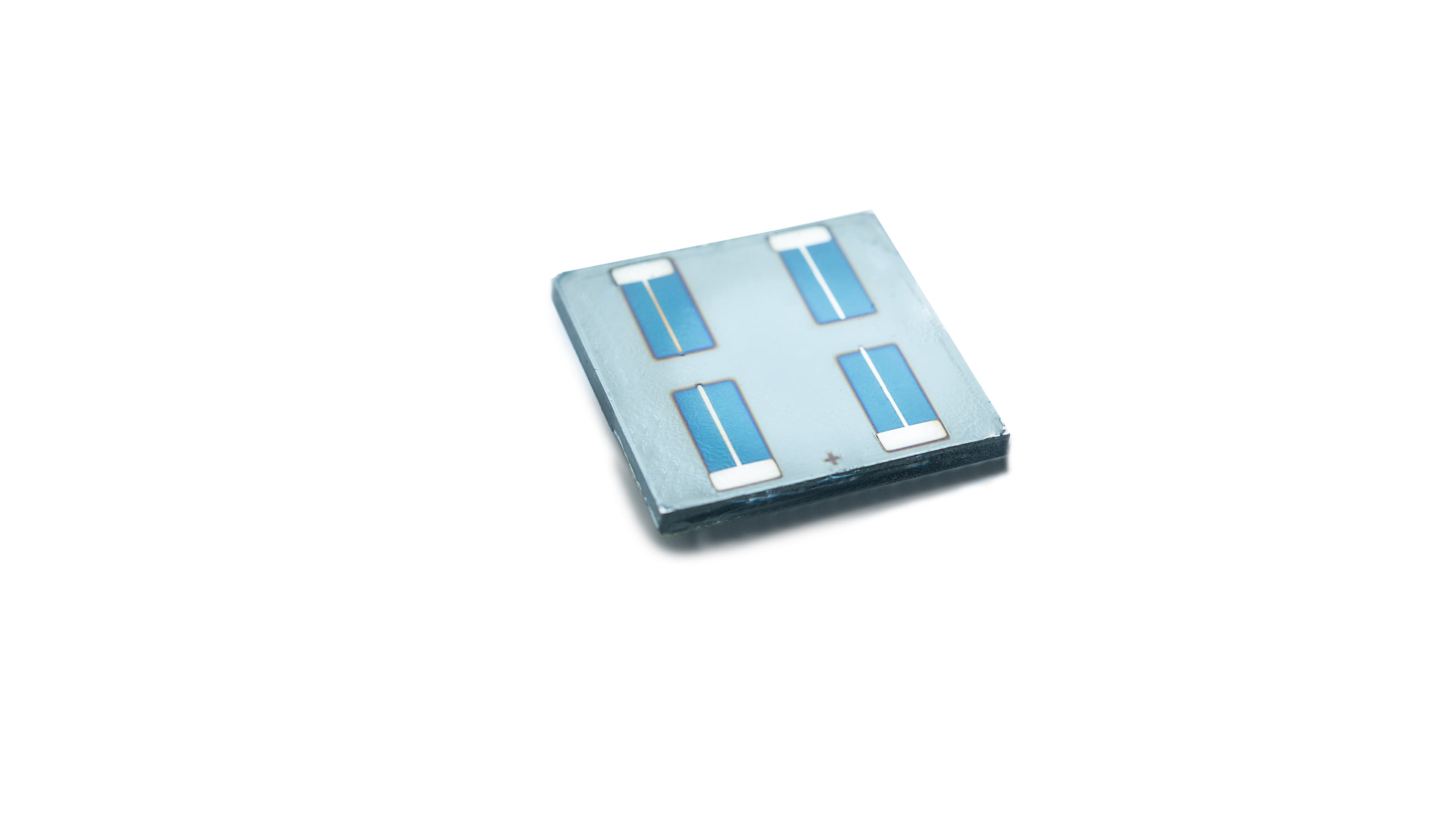 Tandem-solar-cell-%28Perovskite-CIGS%29002 Thin-film tandem solar cell with four blue rectangular contact areas on a small square device