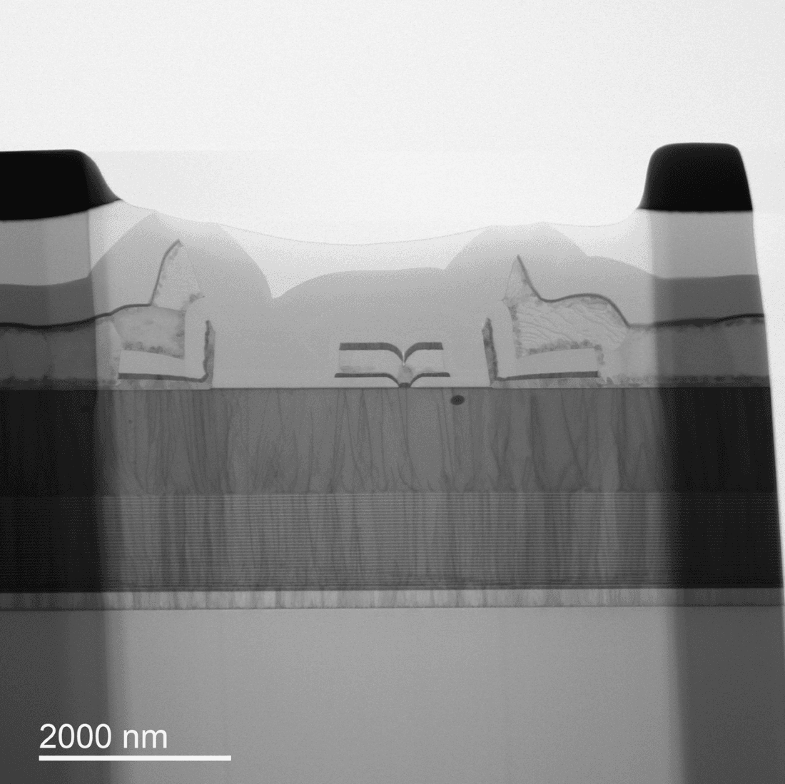 TEM Cross-sectional microscopy image of a GaN-on-Si transistor structure with a 2000 nm scale bar.