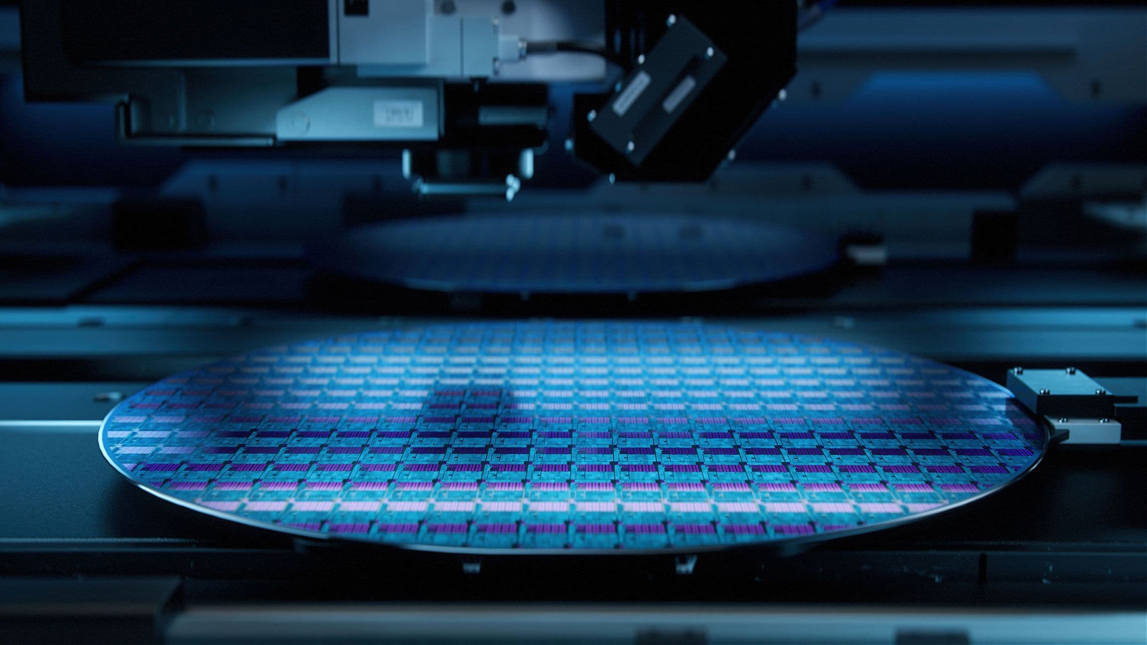 Teradyne%20IC-Link Silicon wafer with colorful chip patterns inside semiconductor equipment