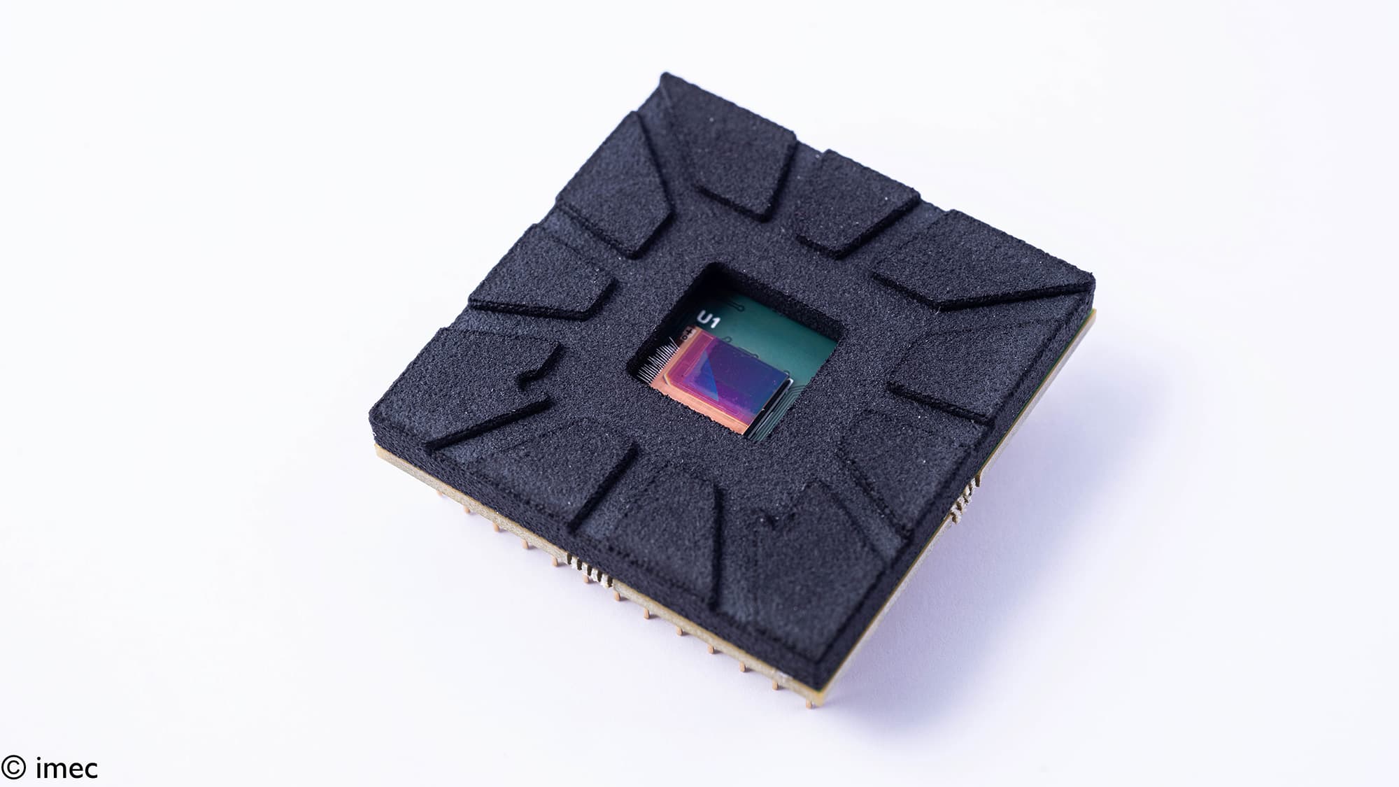 thin-film-imager-sensor_1 Thin-film SWIR image sensor chip with a central exposed die on a white background