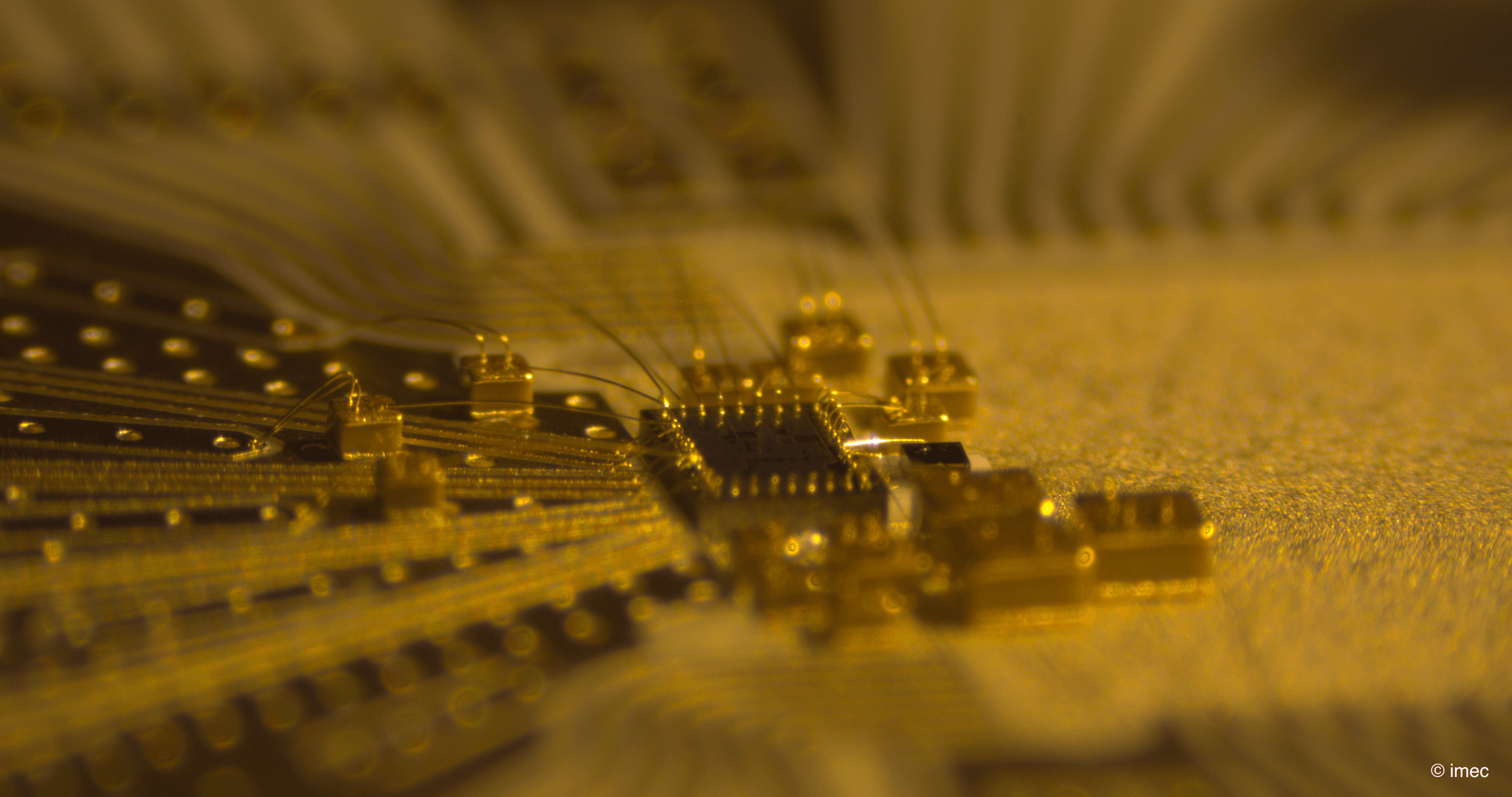 TIA%20chip%20side Side view of a burst-mode receiver chip with gold wire bonds on a circuit board