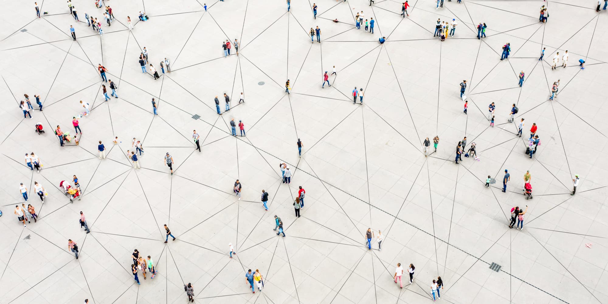 u-blox-header_1 People scattered across a large tiled plaza, linked by intersecting lines suggesting a connected network