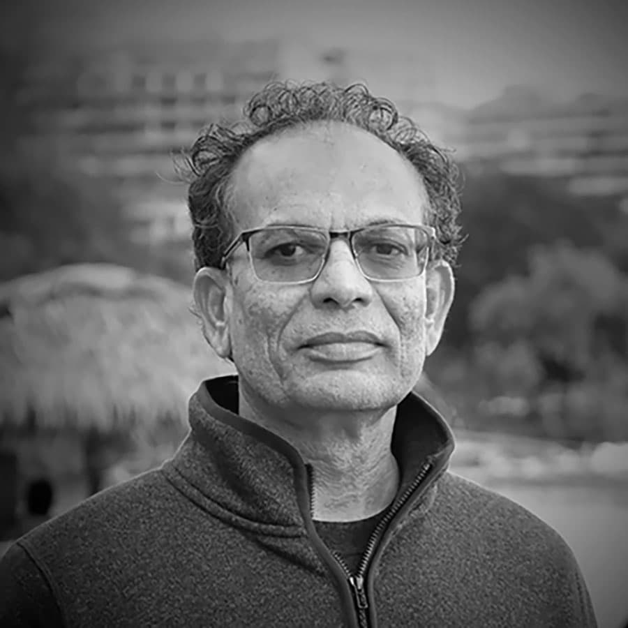 venkat-bw Portrait of Venkat Puntambekar in glasses and a zip-up jacket