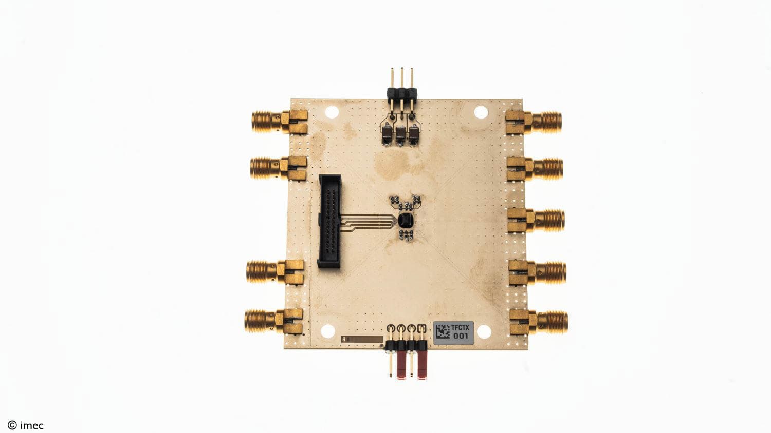 beamforming transceiver chip module Beamforming transceiver chip module with multiple gold connectors on a white background